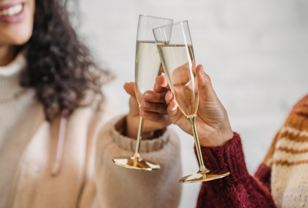 Two women toasting with champagne glasses at the Wentworth.