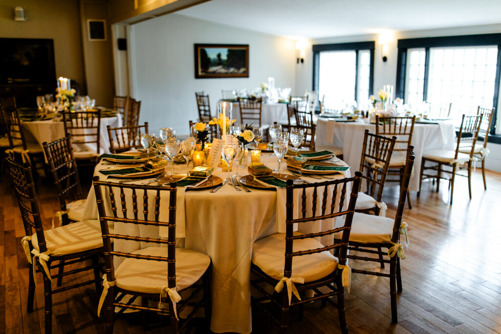 a formal dining room with tables set for a wedding reception.