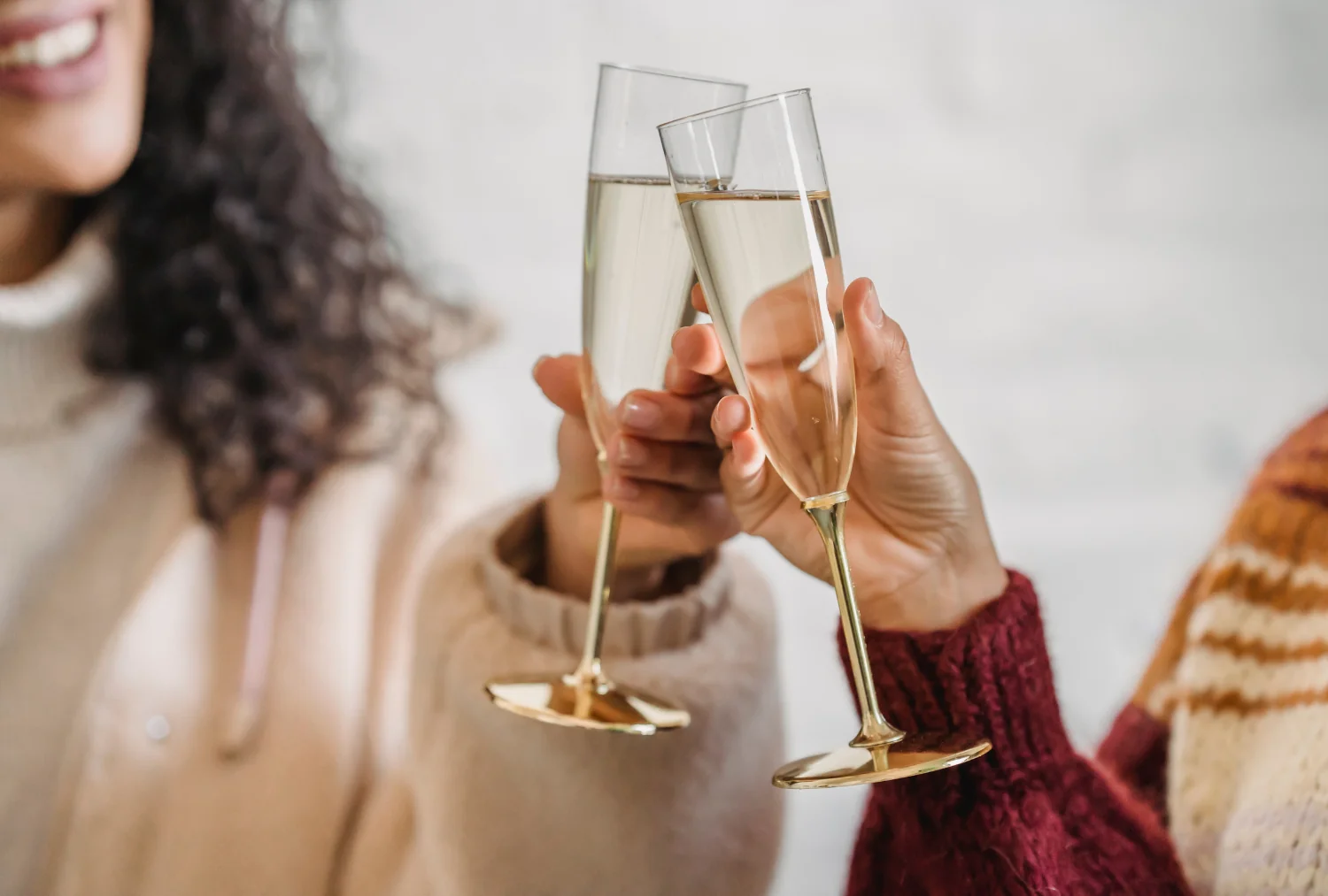 Two women toasting with champagne glasses at the Wentworth.