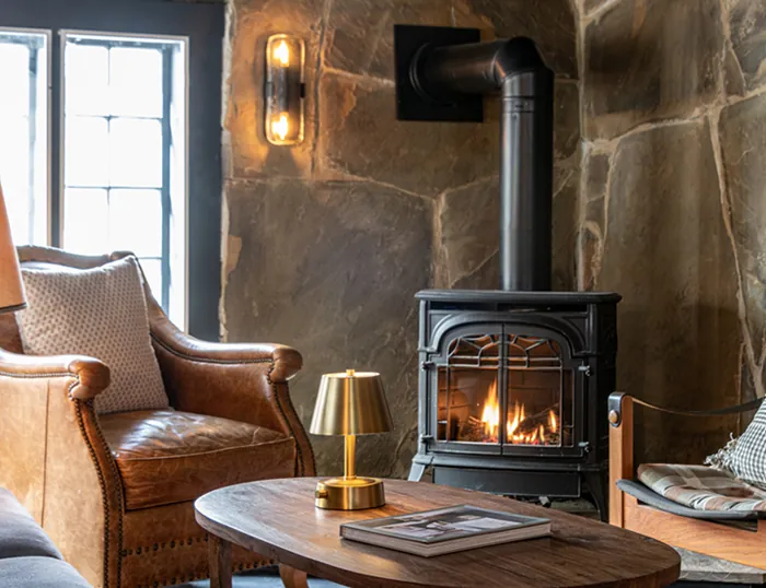 Two chairs by a burning woodstove at the Wentworth.